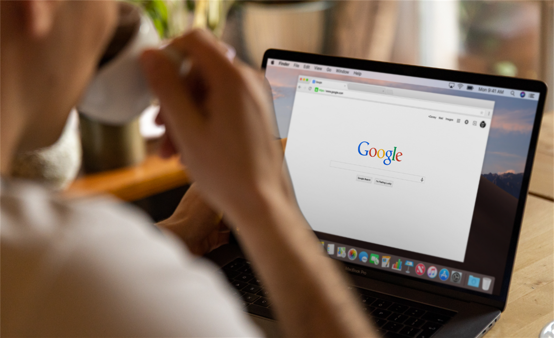 A person using google on their laptop.